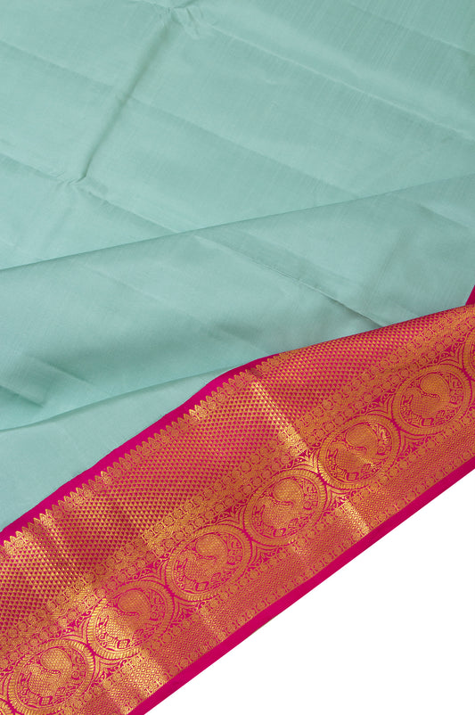 Green Kanchipuram Silk Saree with Dark Pink Border