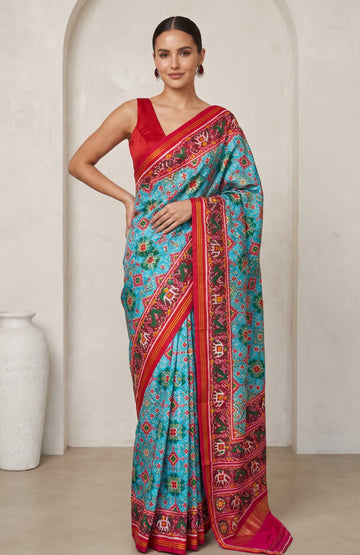 Blue Patan Patola Silk Saree with Pink Floral Border