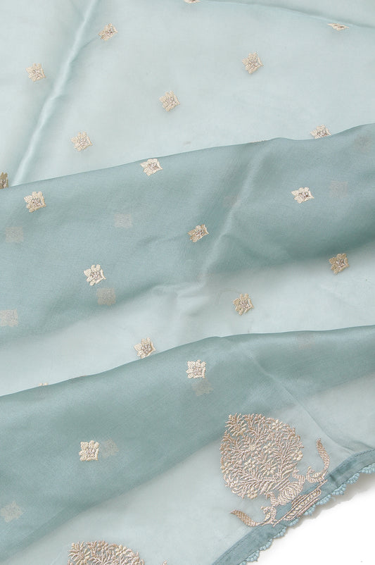 Sea Green Organza Silk Saree with Gold Zari Floral Motifs and Indigo Blue Blouse